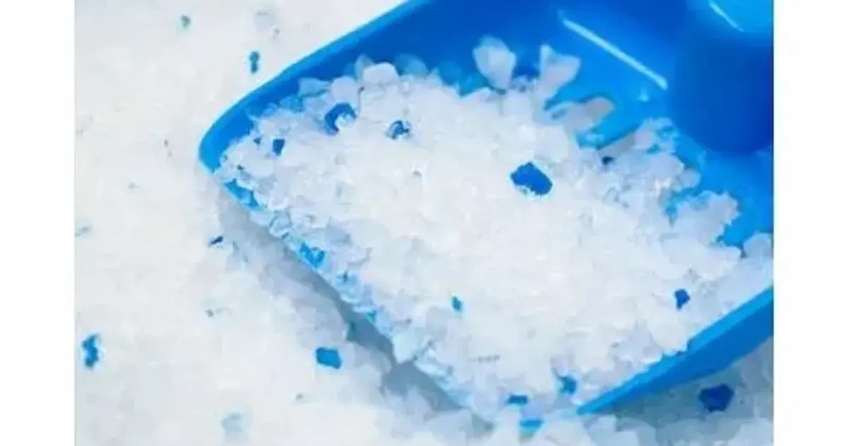 A close view of silica crystal litter beads freshly poured into an empty box